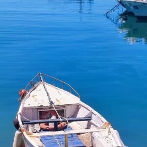 This fishing boat captures Sicily. Built on fishing, but now an empty boat tied to the quay.