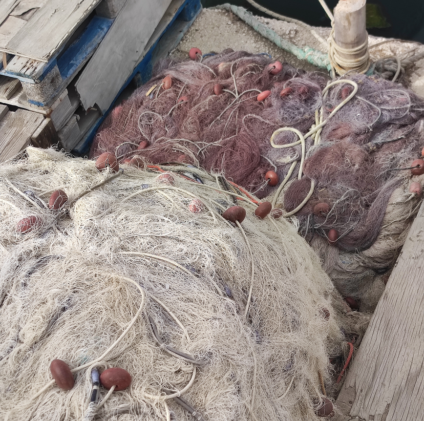 Fishing on the quay side of Selinunte's port lying idle.