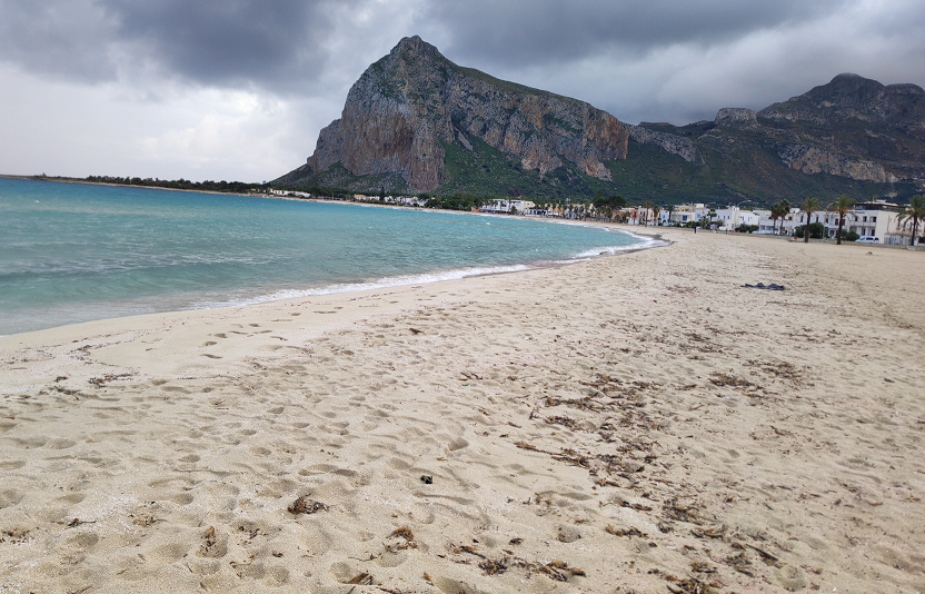 An empty beach in winter at San Vito lo Capo, a place featured in Letters from Sicily snail mail club.